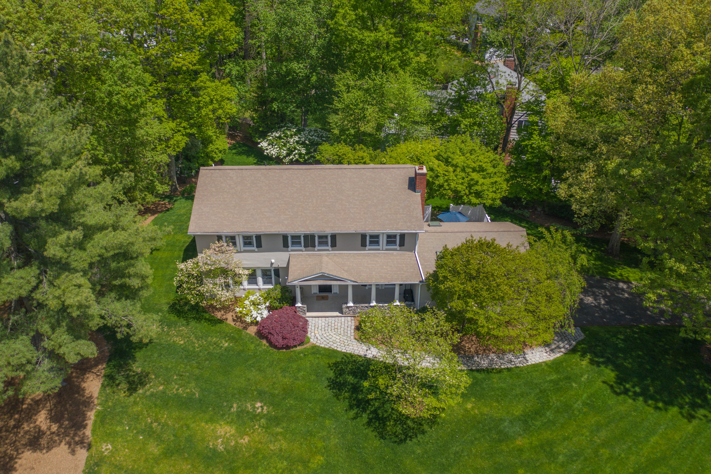 16 Barringer Road Darien, CT 06820 - Photo 2 of 43 a view of a house with a yard and sitting area