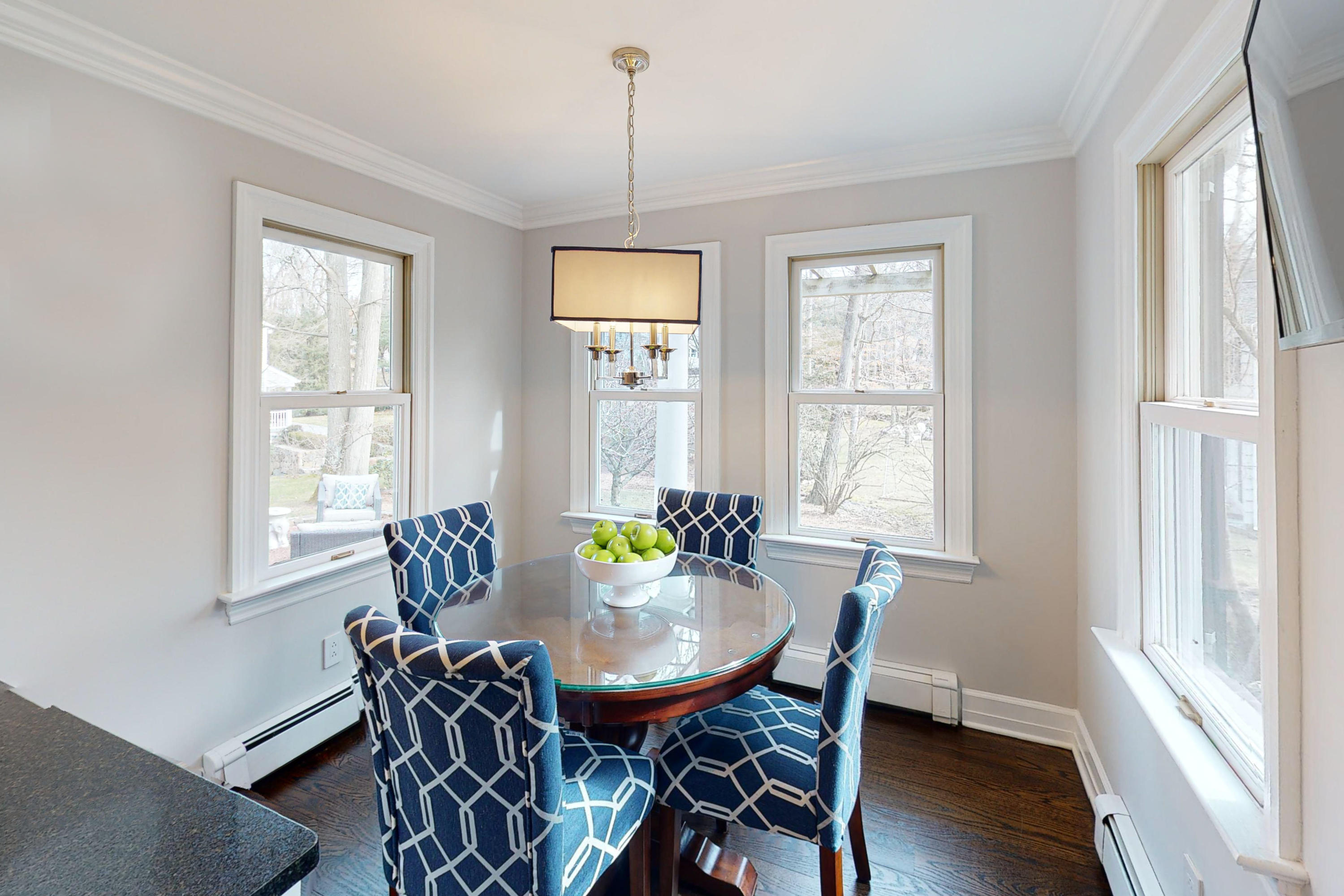16 Barringer Road Darien, CT 06820 - Photo 22 of 43 a view of a dining room with furniture window and wooden floor