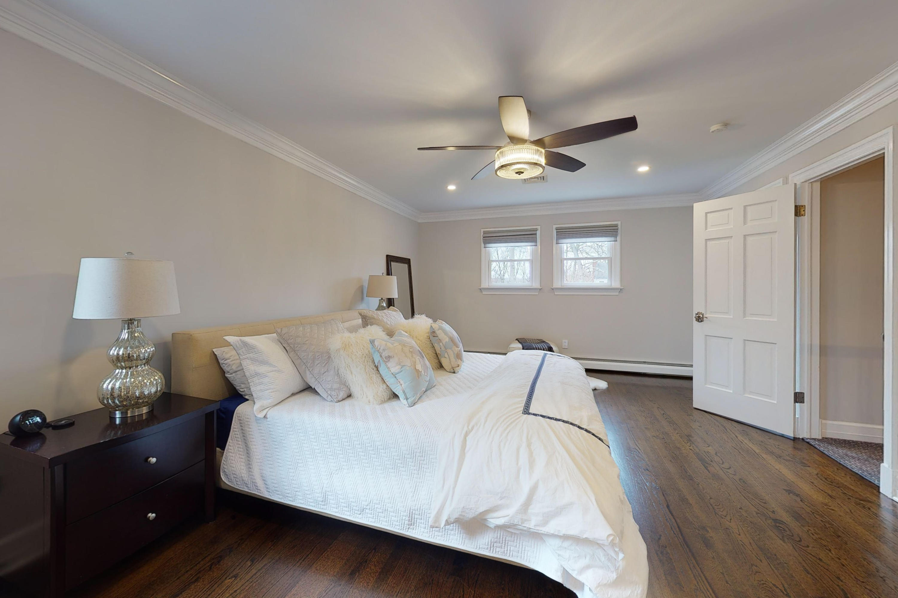 16 Barringer Road Darien, CT 06820 - Photo 27 of 43 a bedroom with a bed and a lamp