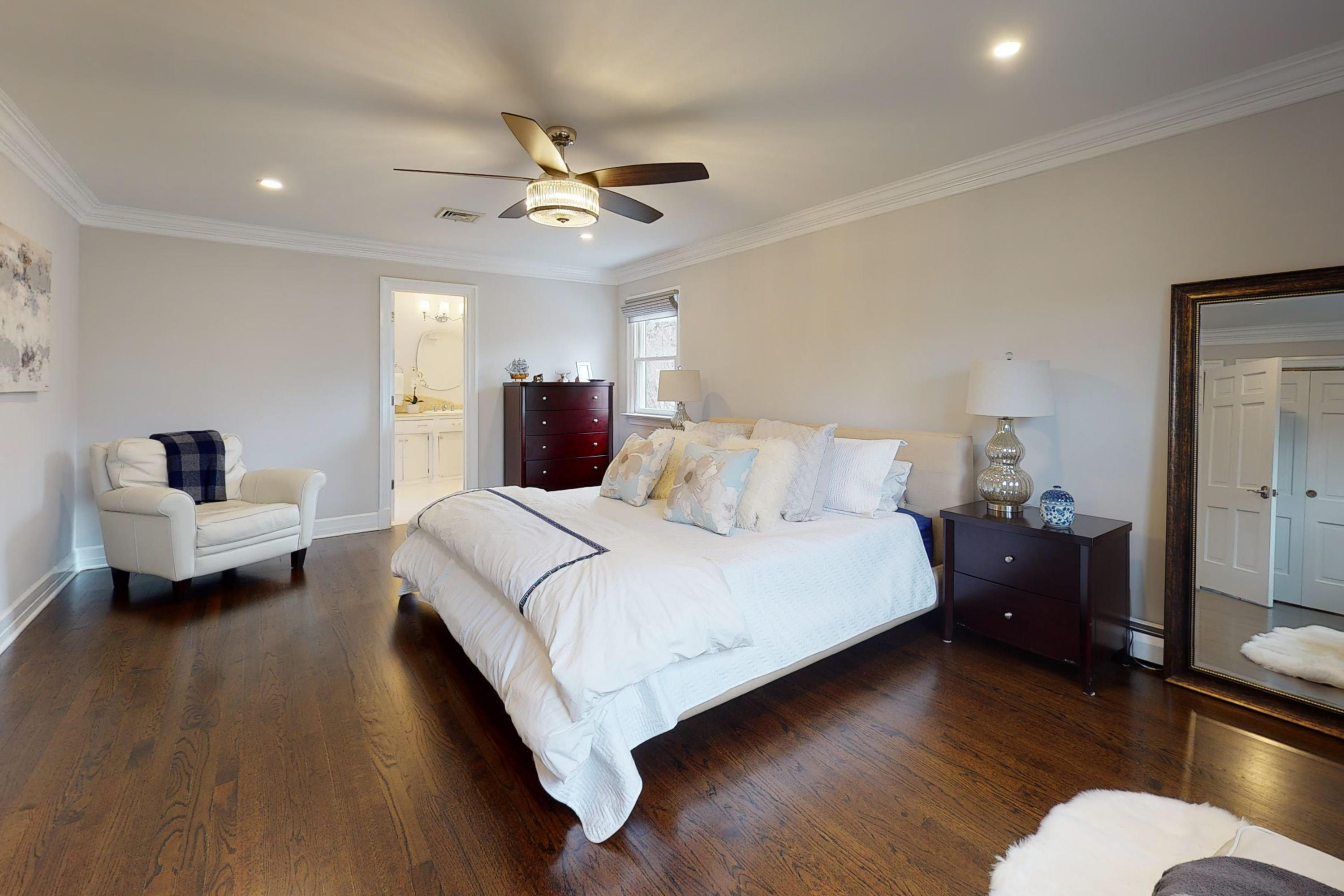 16 Barringer Road Darien, CT 06820 - Photo 28 of 43 a bedroom with a bed and wooden floor