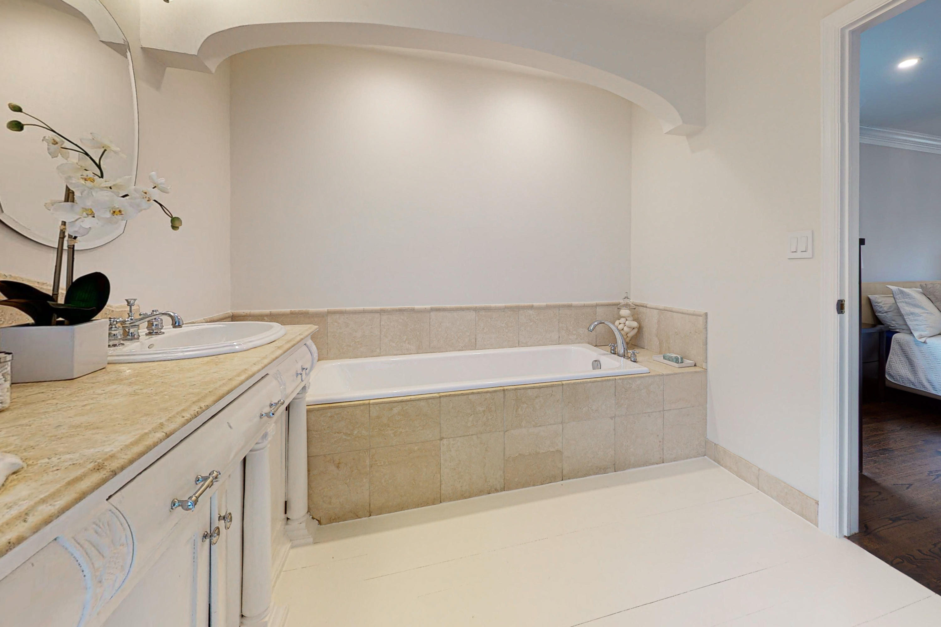 16 Barringer Road Darien, CT 06820 - Photo 30 of 43 a spacious bathroom with a tub sink and mirror