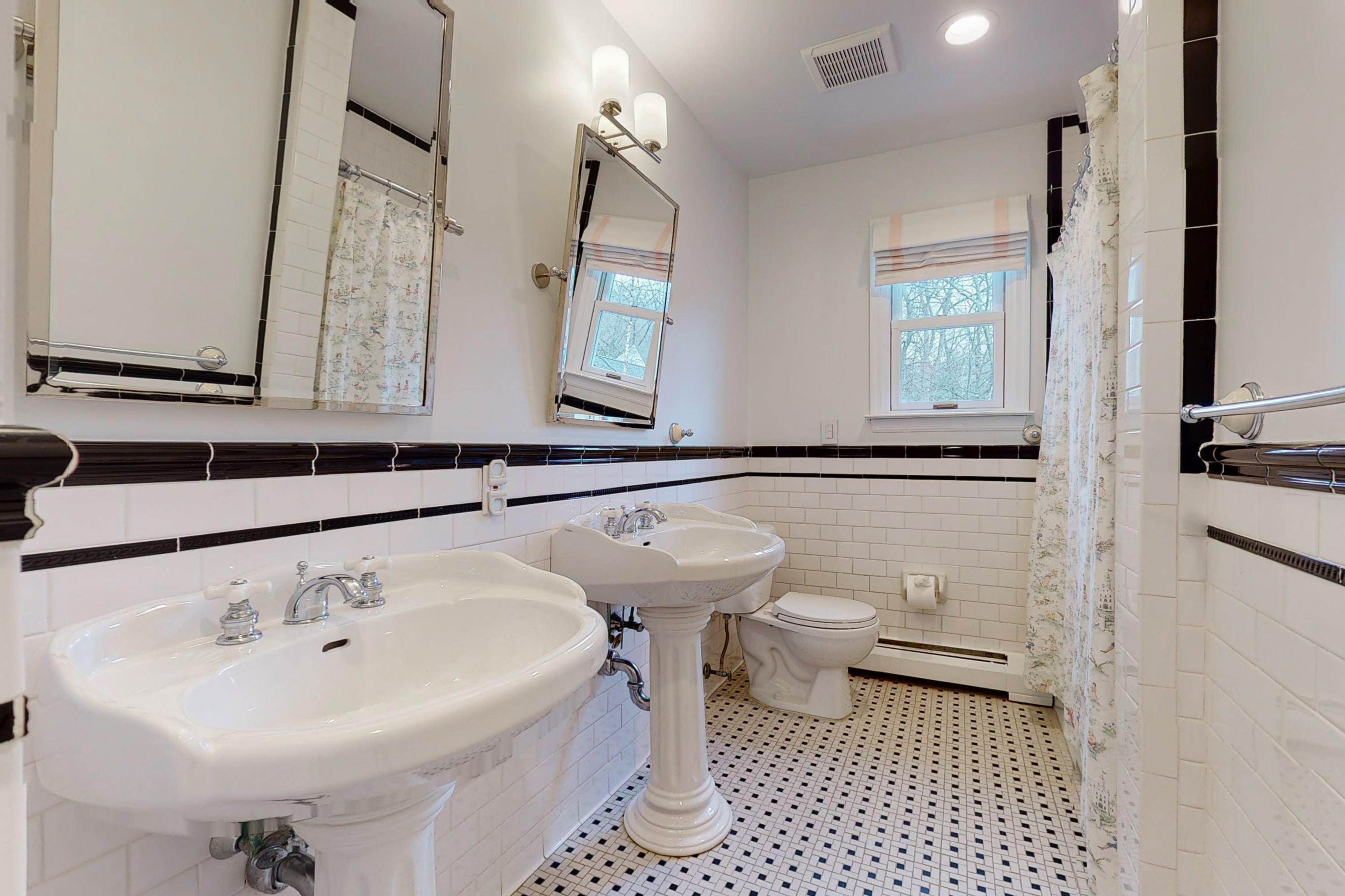 16 Barringer Road Darien, CT 06820 - Photo 36 of 43 a bathroom with a sink a toilet and mirror