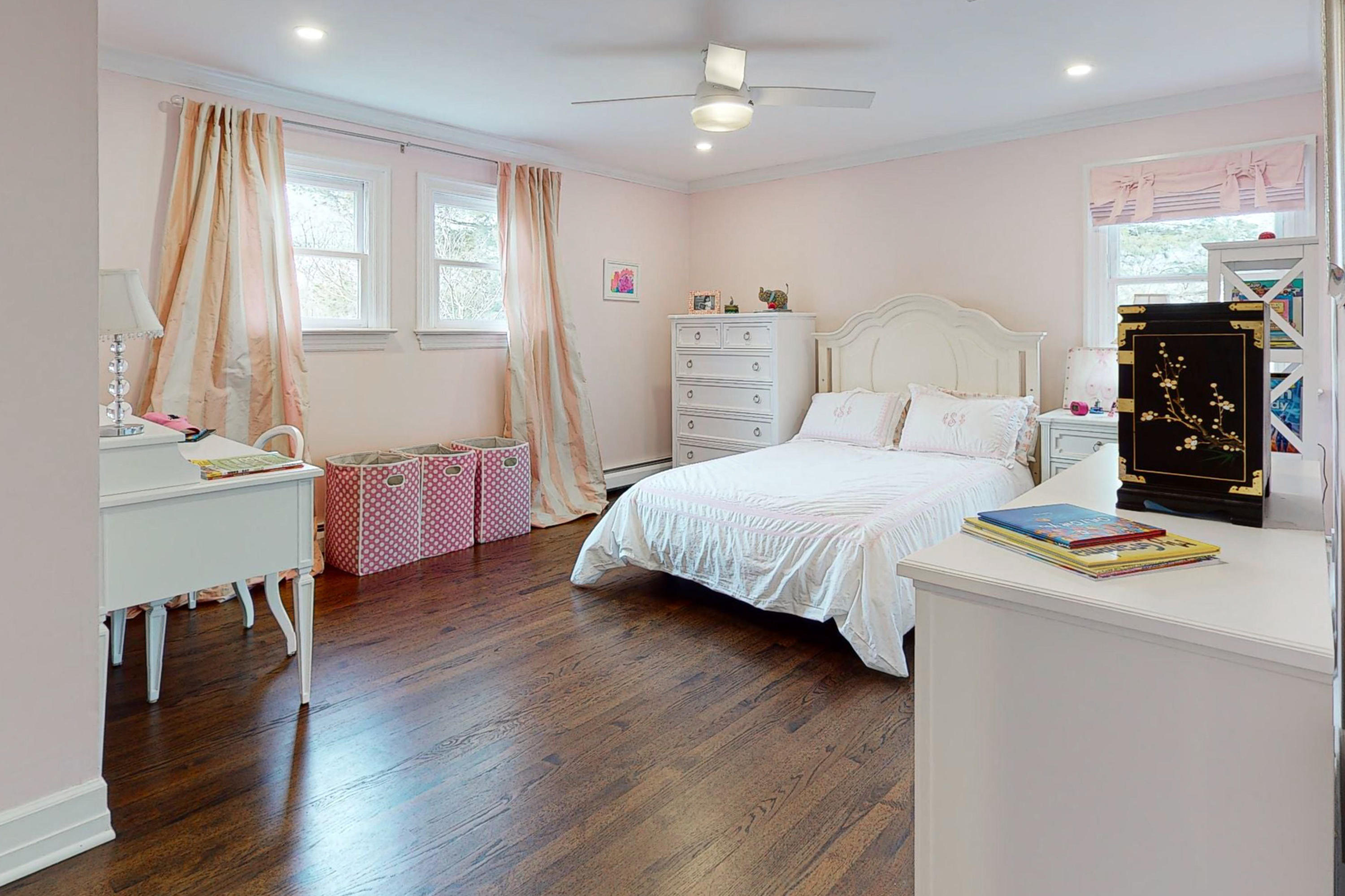 16 Barringer Road Darien, CT 06820 - Photo 37 of 43 a bedroom with a bed and wooden floor