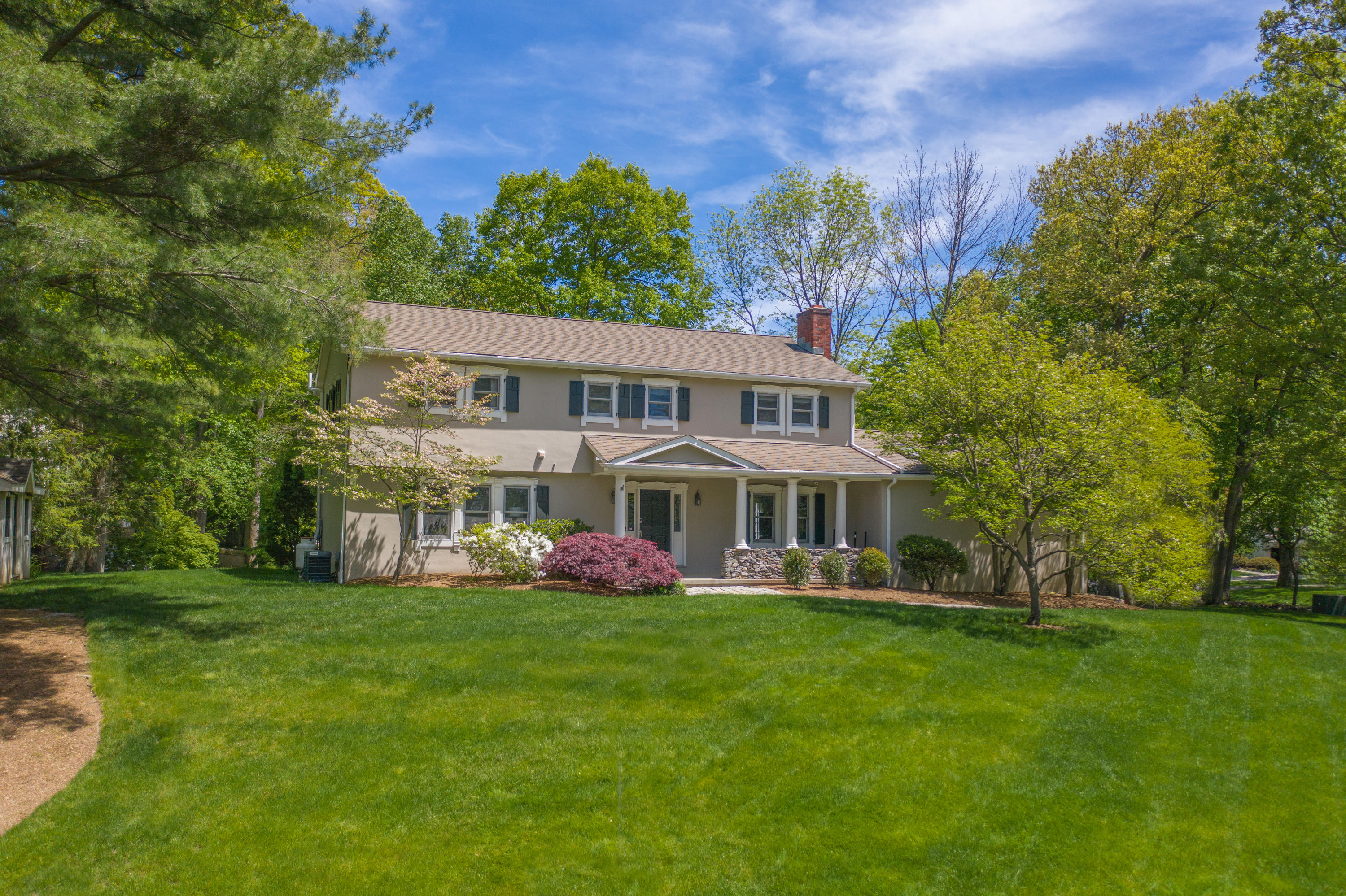 16 Barringer Road Darien, CT 06820 - Photo 40 of 43 a front view of a house with garden