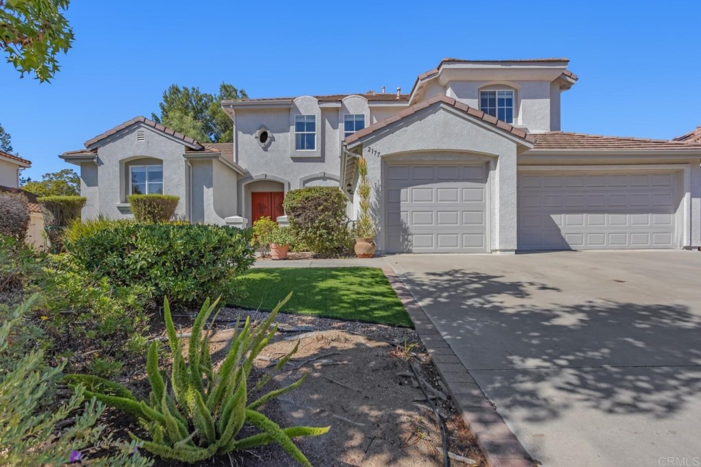 2177 Stone Castle Fallbrook, CA 92028 - Photo 1 of 1 a front view of a house with garden