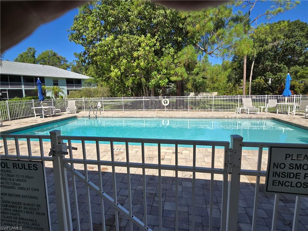 5737 Whitaker Road, Unit C104 Naples, FL 34112 - Photo 4 of 35 Get your tan laying out by the Community pool
