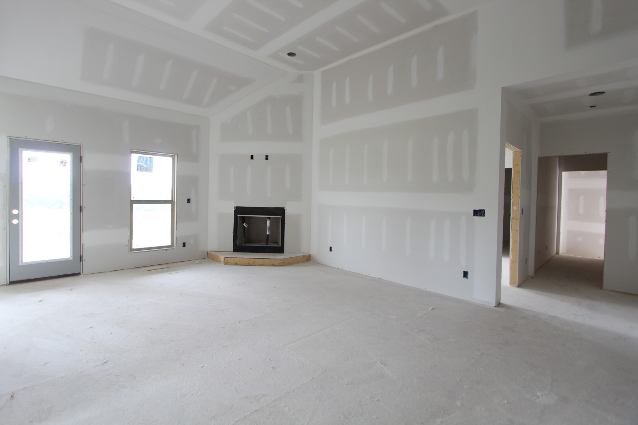 503 Cole's Ferry Road, Unit 5 Gallatin, TN 37066 - Photo 4 of 9 an empty room with fireplace and windows