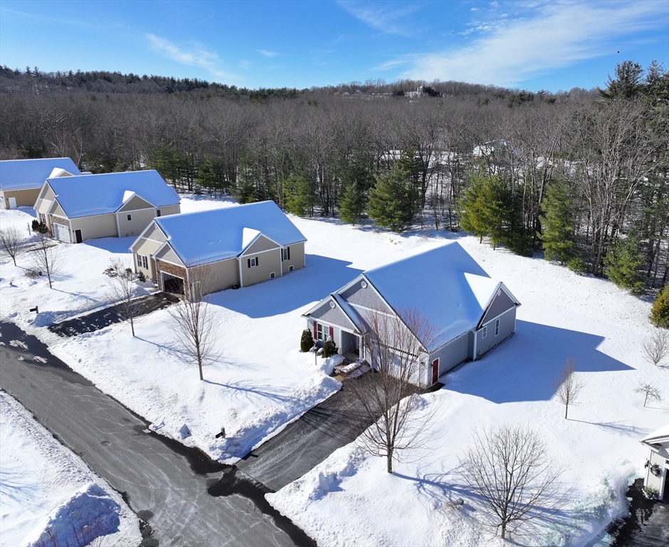 a view of a terrace with couches and sky view