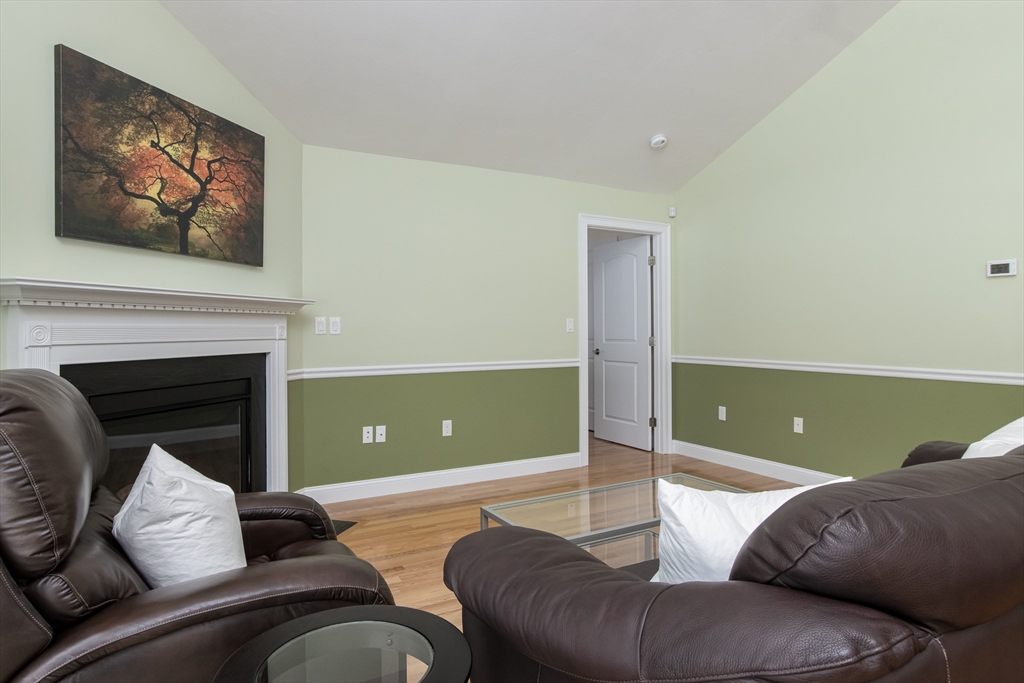 43 Old Mill Circle Westminster, MA 01473 - Photo 14 of 30 a living room with furniture and a fireplace