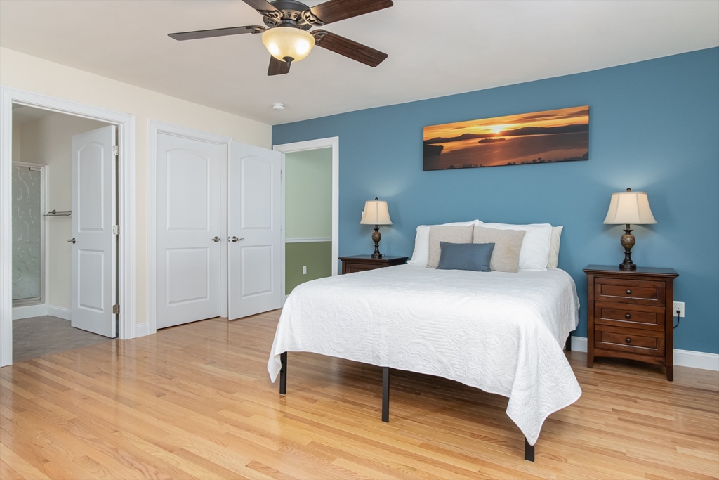 43 Old Mill Circle Westminster, MA 01473 - Photo 17 of 30 a bedroom with a bed and a chandelier