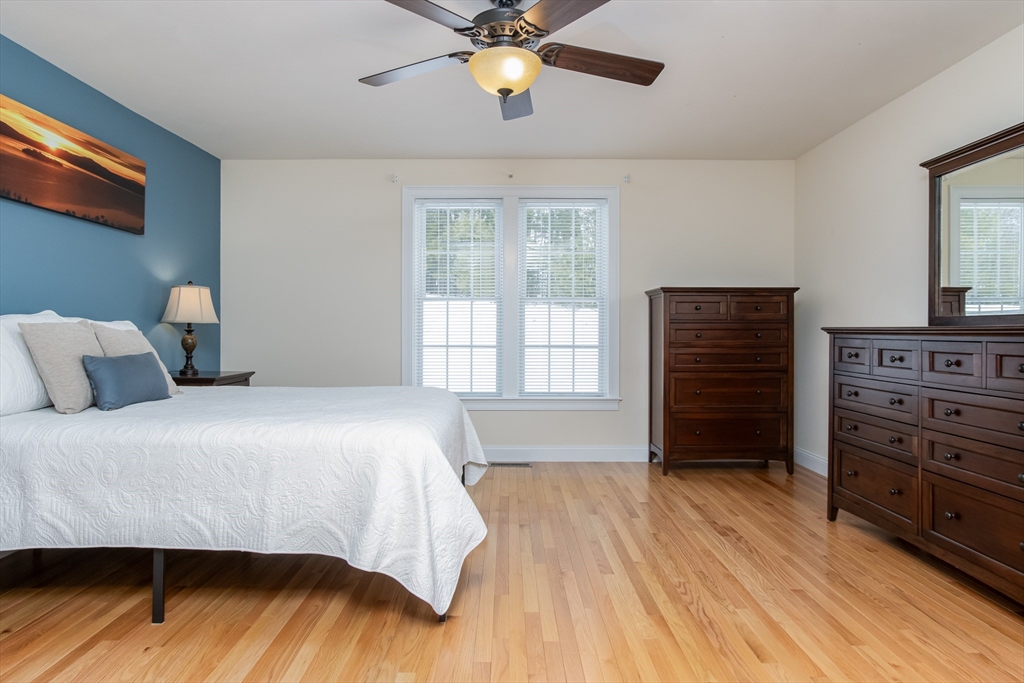 43 Old Mill Circle Westminster, MA 01473 - Photo 19 of 30 a bedroom with a bed and wooden floor