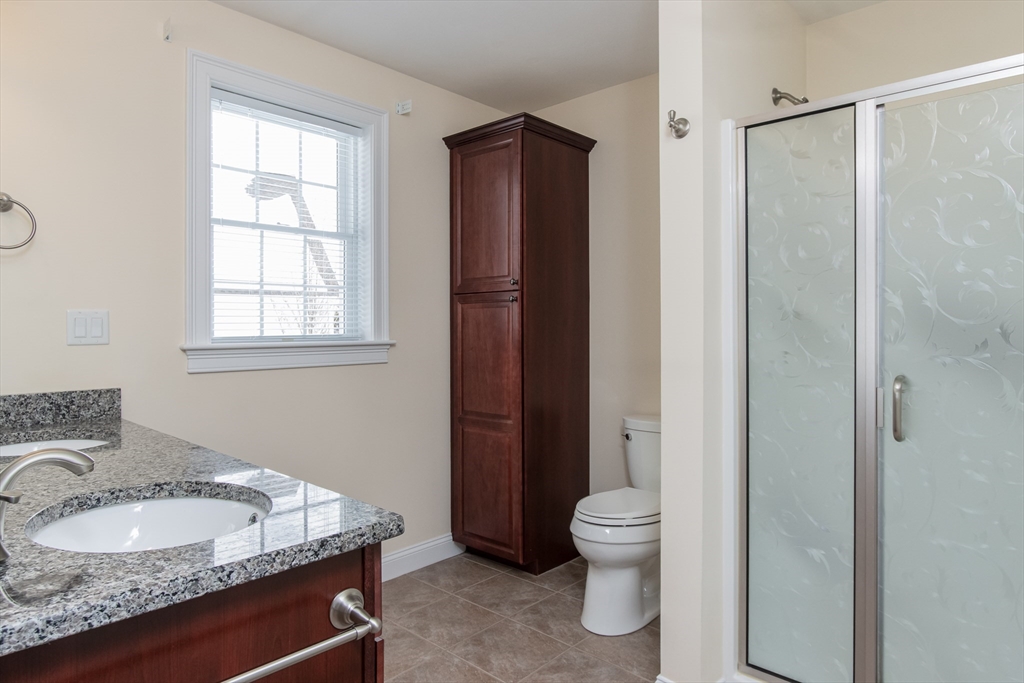 43 Old Mill Circle Westminster, MA 01473 - Photo 21 of 30 a bathroom with a granite countertop sink toilet and shower