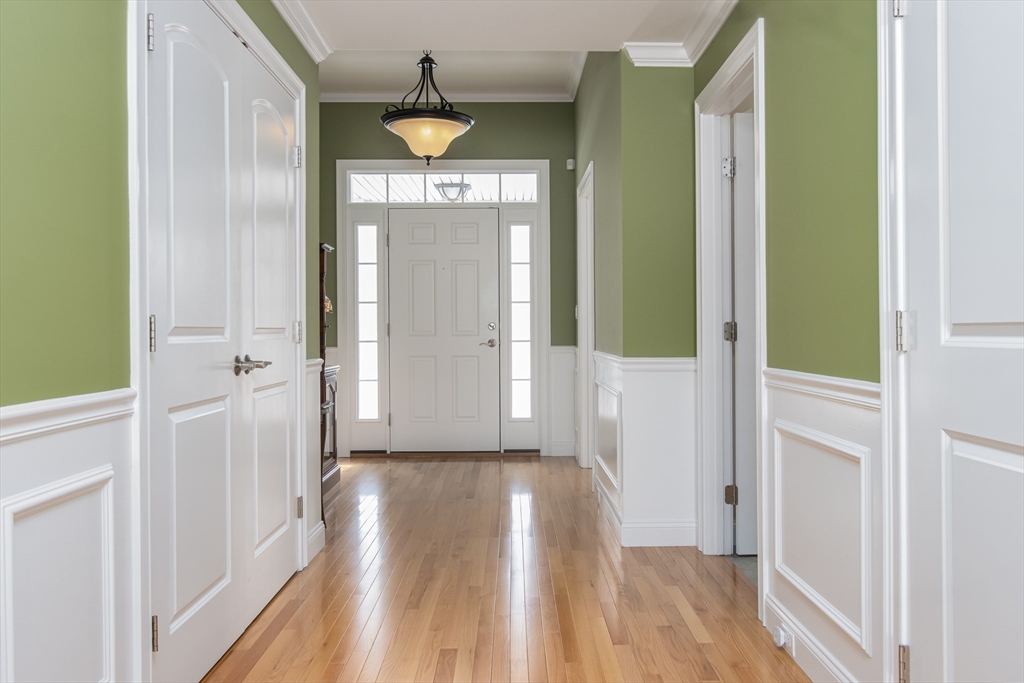 43 Old Mill Circle Westminster, MA 01473 - Photo 4 of 30 a view of a hallway with wooden floor and staircase