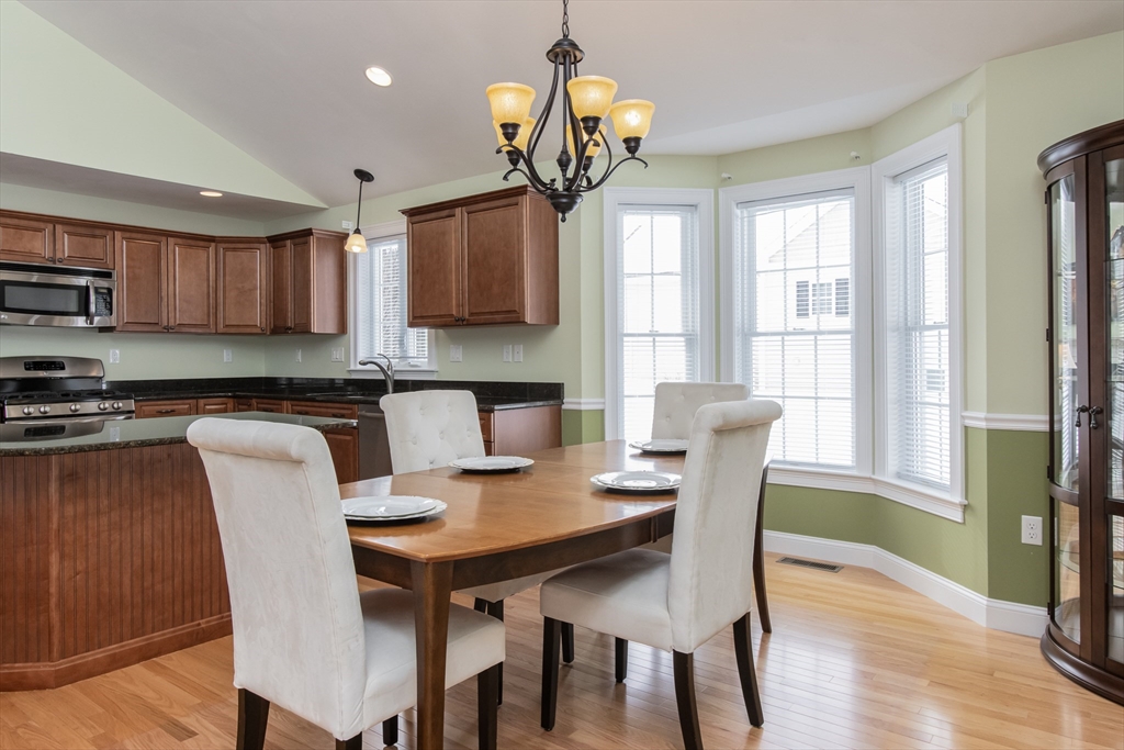 43 Old Mill Circle Westminster, MA 01473 - Photo 10 of 30 a view of a dining room with furniture a chandelier and wooden floor