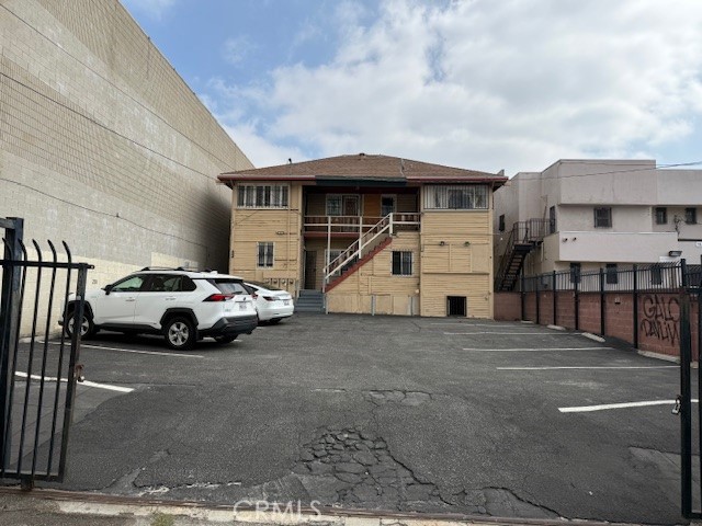811 1/2 South Vermont Avenue Los Angeles, CA 90005 - Photo 2 of 5 a view of building with car parked