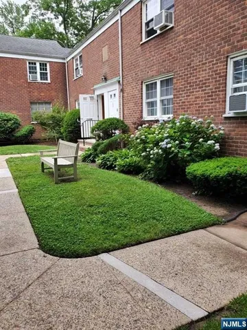 a view of a house with a garden