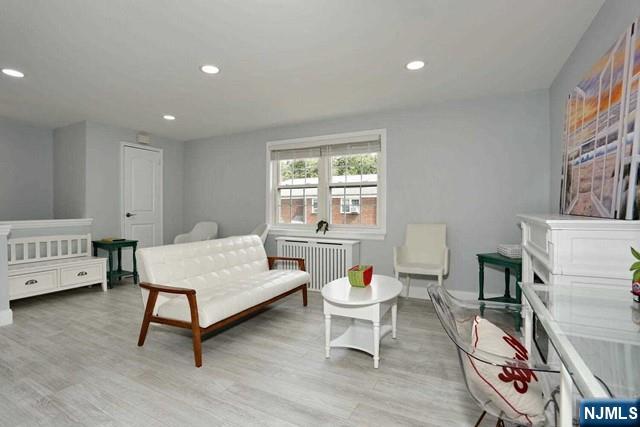 100 Huguenot Avenue, Unit 6B Englewood, NJ 07631 - Photo 8 of 24 a living room with furniture and a window
