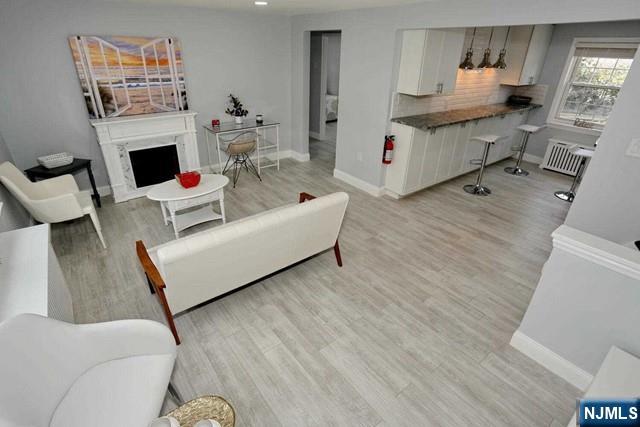 100 Huguenot Avenue, Unit 6B Englewood, NJ 07631 - Photo 10 of 24 a living room with furniture and a fireplace