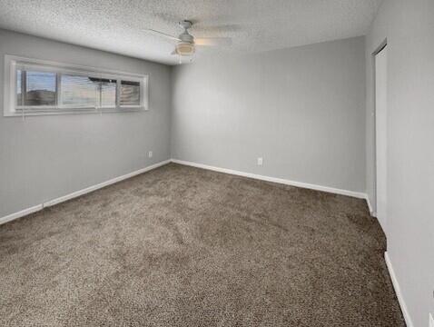 2107 35th Street, Unit B Lubbock, TX 79412 - Photo 13 of 18 an empty room with windows