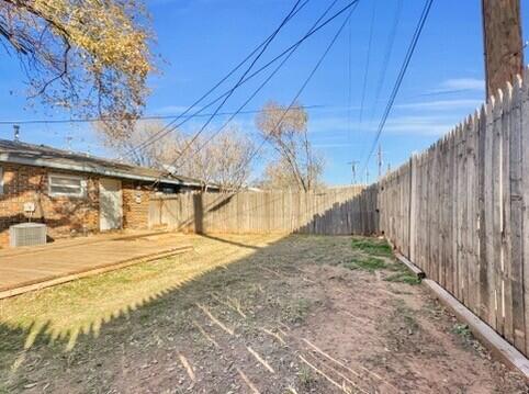 2107 35th Street, Unit B Lubbock, TX 79412 - Photo 18 of 18 a view of back yard of the house