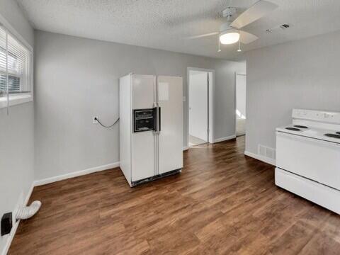 2107 35th Street, Unit B Lubbock, TX 79412 - Photo 6 of 18 a view of a kitchen with wooden floor