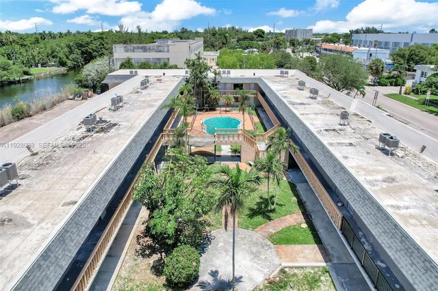 an aerial view of a house with outdoor space
