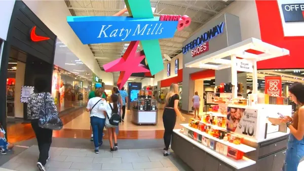 a view of city with the shops and a people