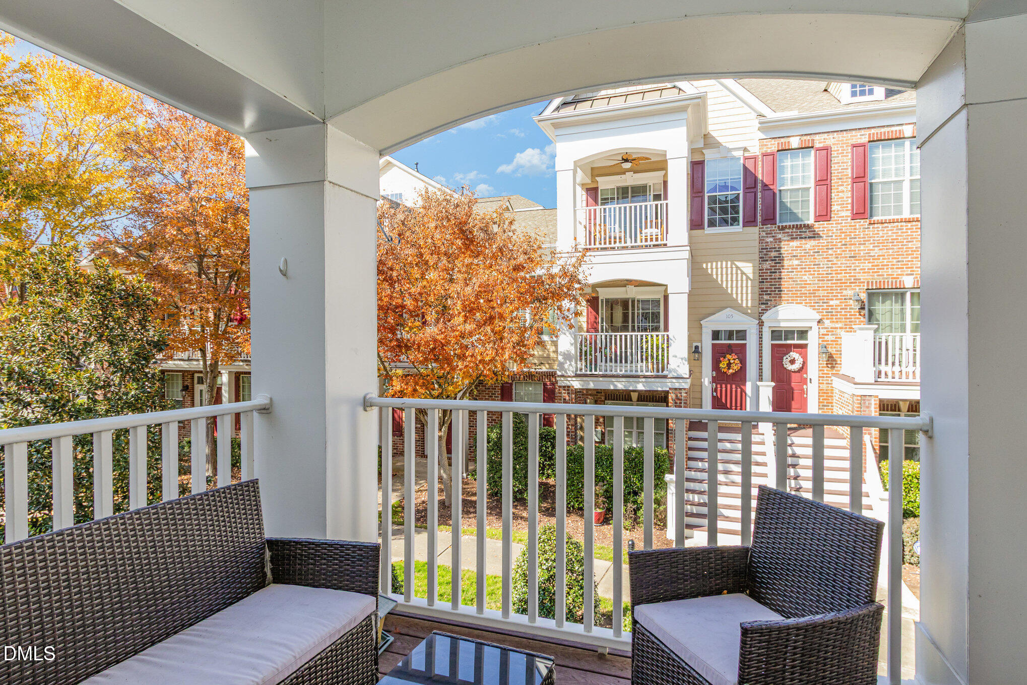 9211 Calabria Drive, Unit 117 Raleigh, NC 27617 - Photo 18 of 19 a view of a chair and table in the balcony