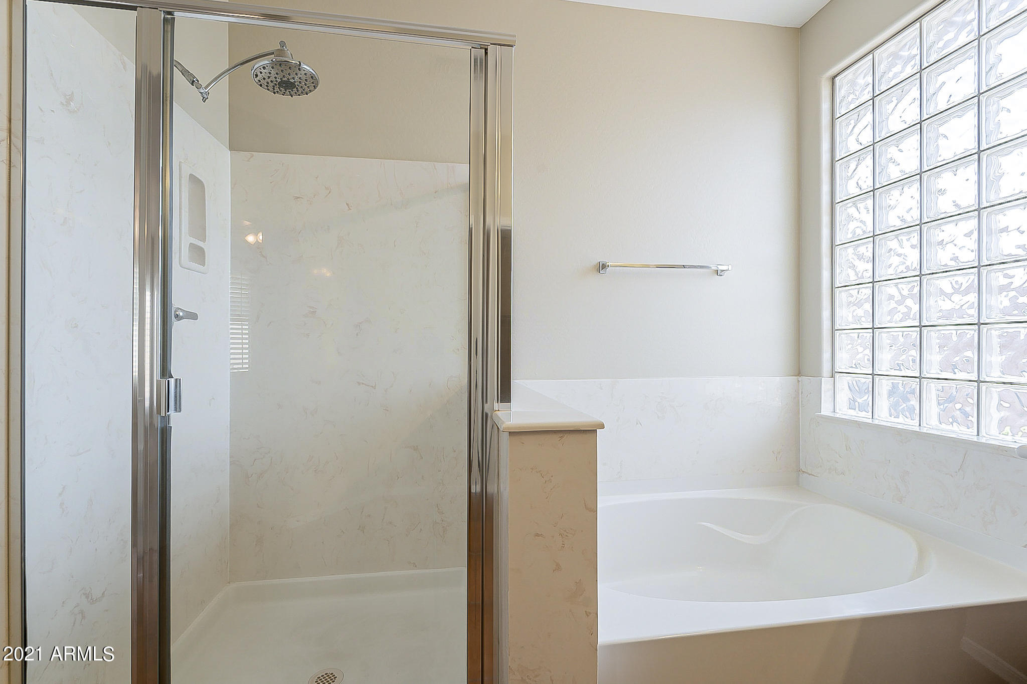 15346 West Boca Raton Road Surprise, AZ 85379 - Photo 29 of 45 a bathroom with a bathtub and a shower