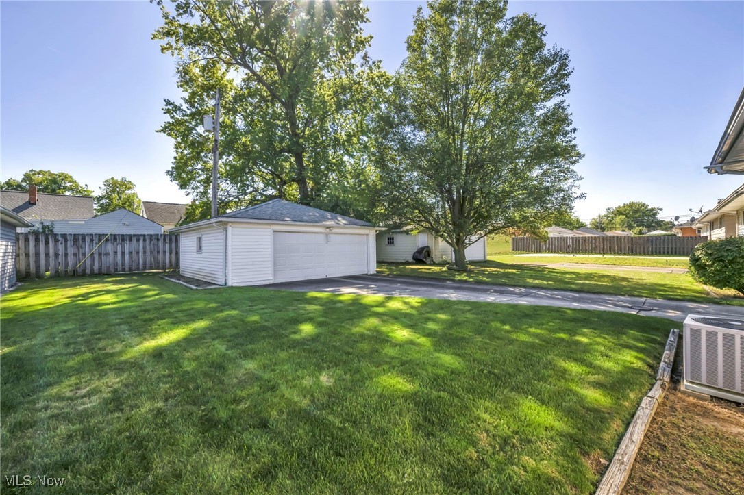 13732 Carpenter Road Garfield Heights, OH 44125 - Photo 36 of 46 View of yard with a detached garage and an outdoor structure
