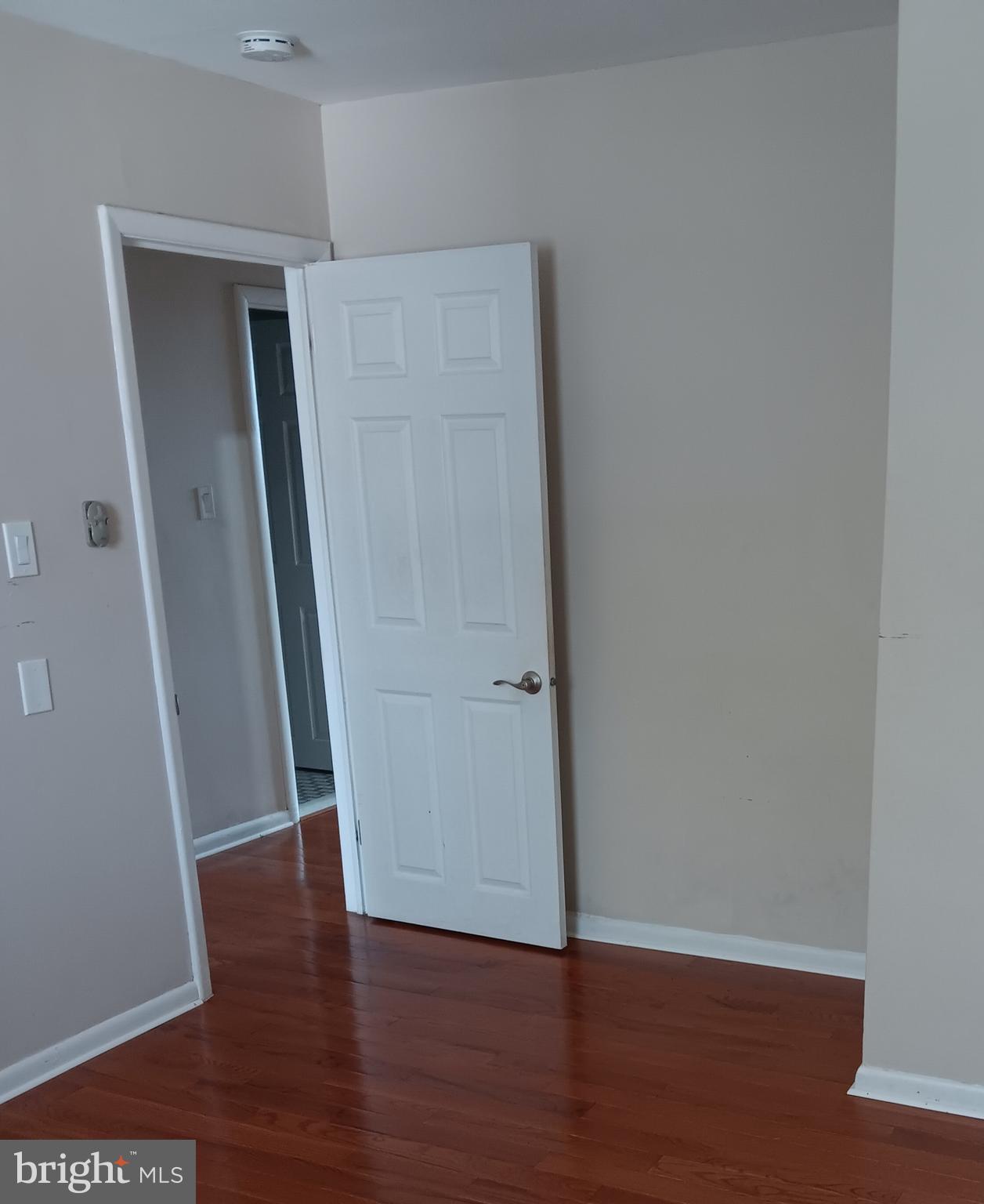 153 Burmont Road, Unit B Drexel Hill, PA 19026 - Photo 9 of 19 a view of an empty room with wooden floor