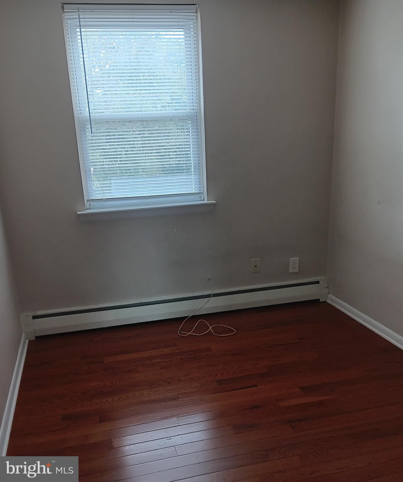 153 Burmont Road, Unit B Drexel Hill, PA 19026 - Photo 10 of 19 a view of a small space with wooden floor and a window