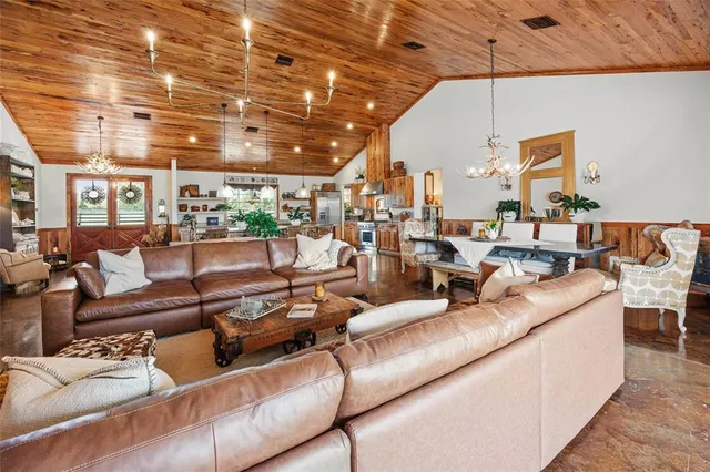 a view of a patio with a table and chairs under an umbrella
