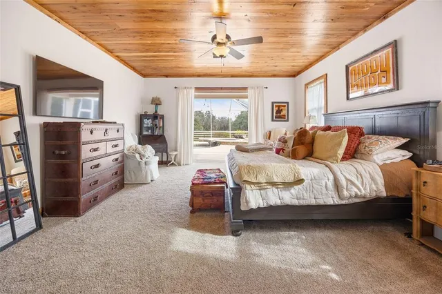 a bathroom with a granite countertop sink a toilet and a mirror