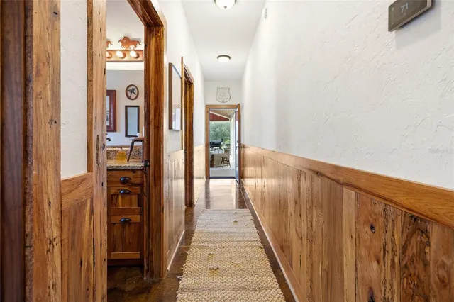 a house view with swimming pool in front of it