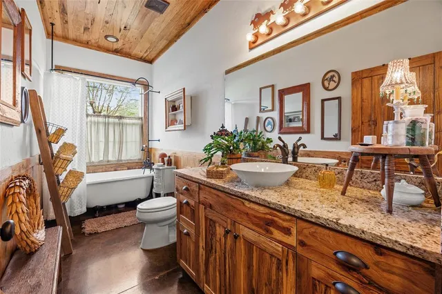 a view of a swimming pool with table and chairs a barbeque with wooden fence