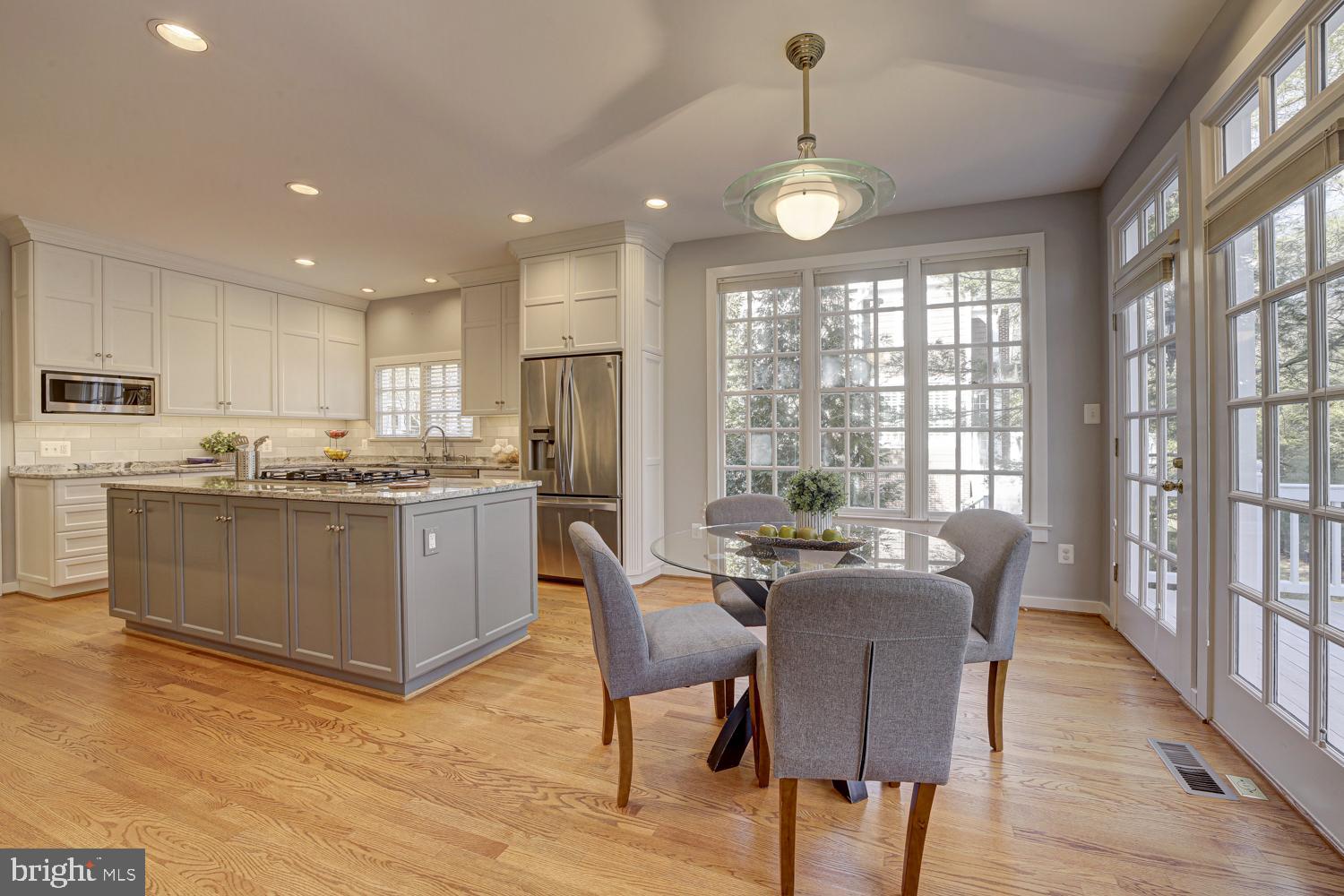 10505 Democracy Lane Potomac, MD 20854 - Photo 16 of 47 a view of a dining room with furniture window and wooden floor