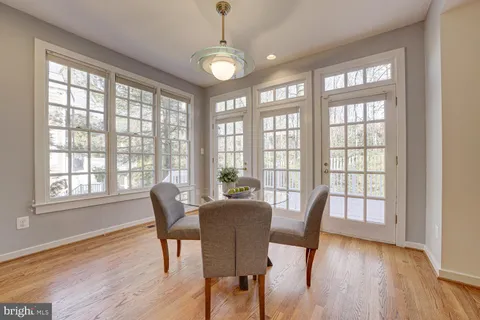 a view of a dining room with furniture and windows