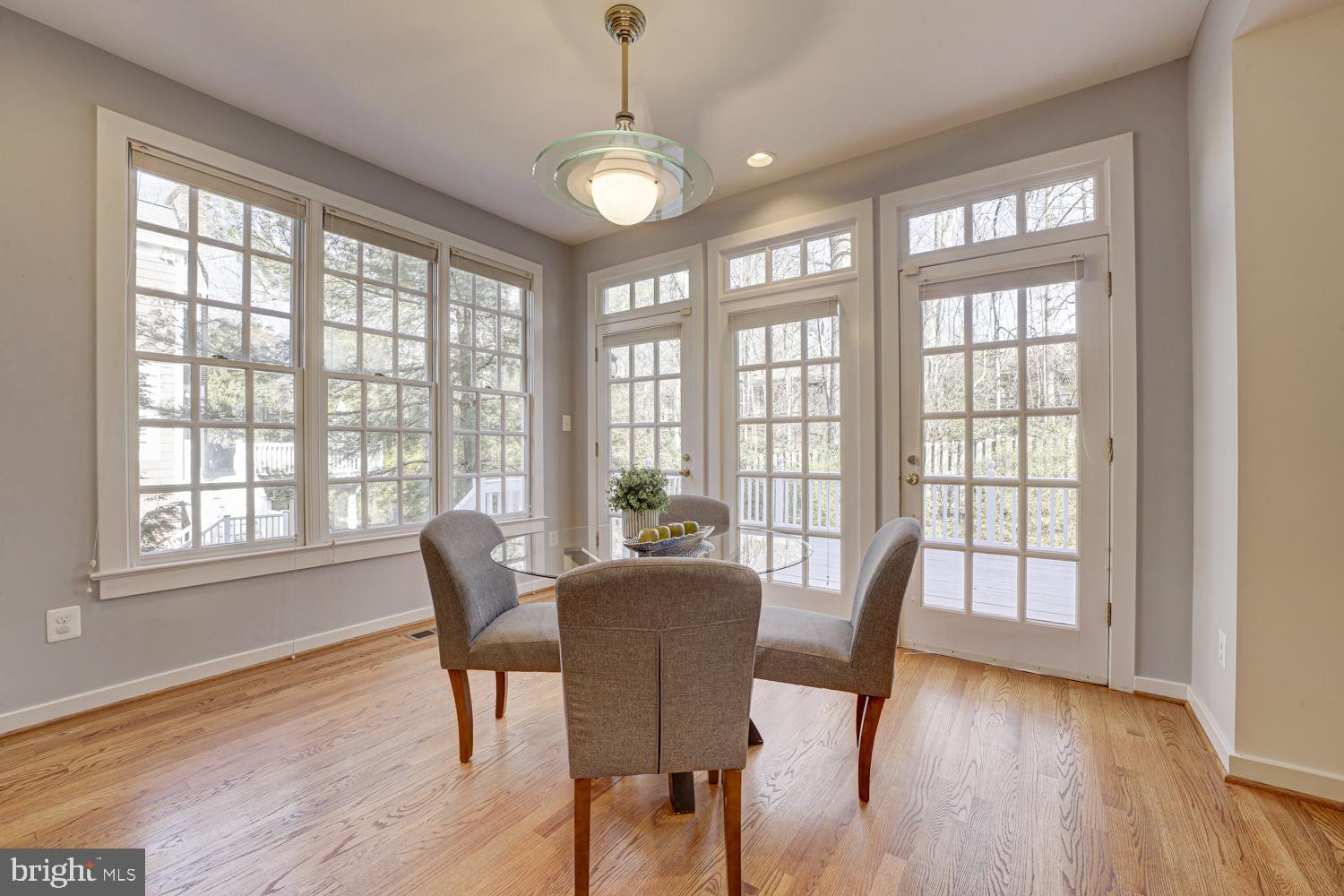10505 Democracy Lane Potomac, MD 20854 - Photo 17 of 47 a view of a dining room with furniture and windows