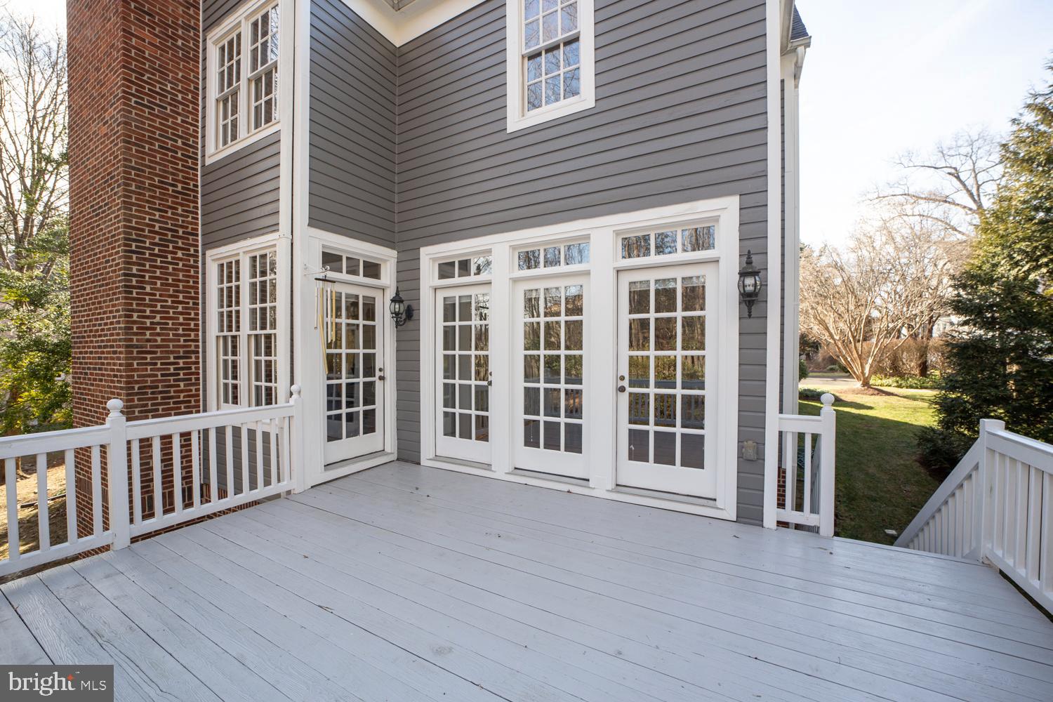 10505 Democracy Lane Potomac, MD 20854 - Photo 19 of 47 a view of a house with deck and floor to ceiling window