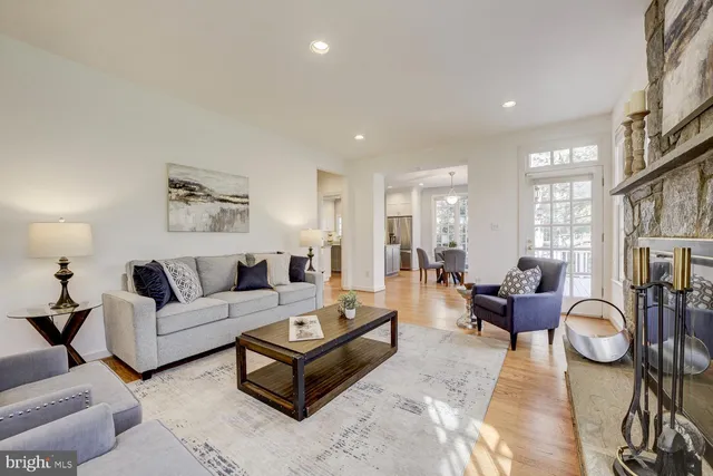 a living room with furniture fireplace and window