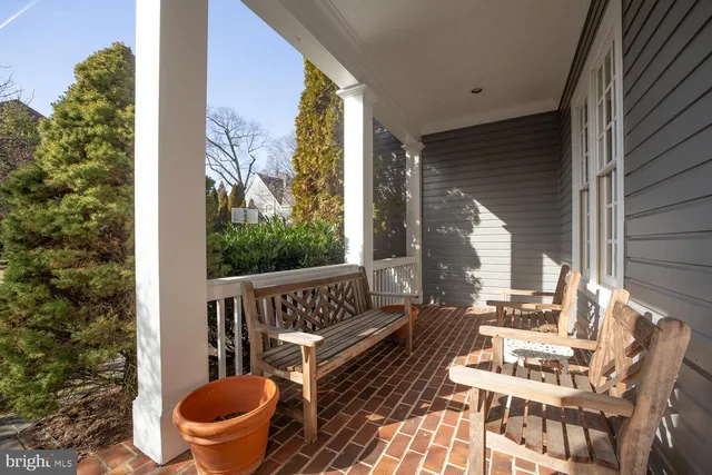 a view of balcony with wooden floor and outdoor seating