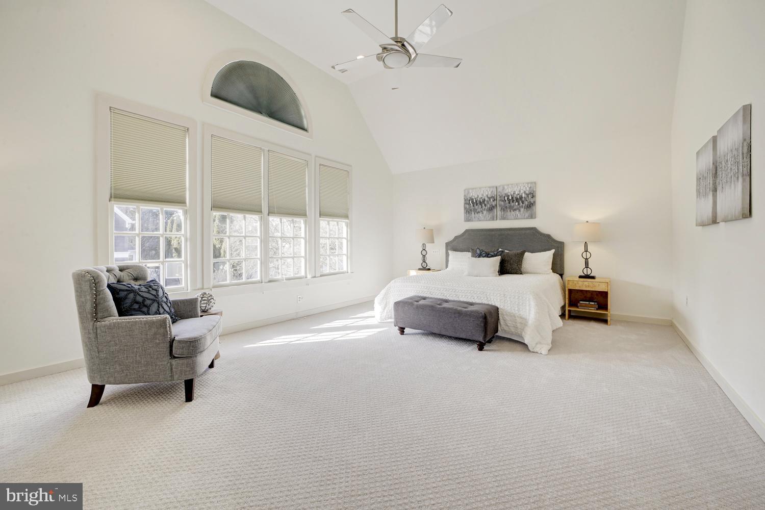 10505 Democracy Lane Potomac, MD 20854 - Photo 25 of 47 a bedroom with a bed and a large window