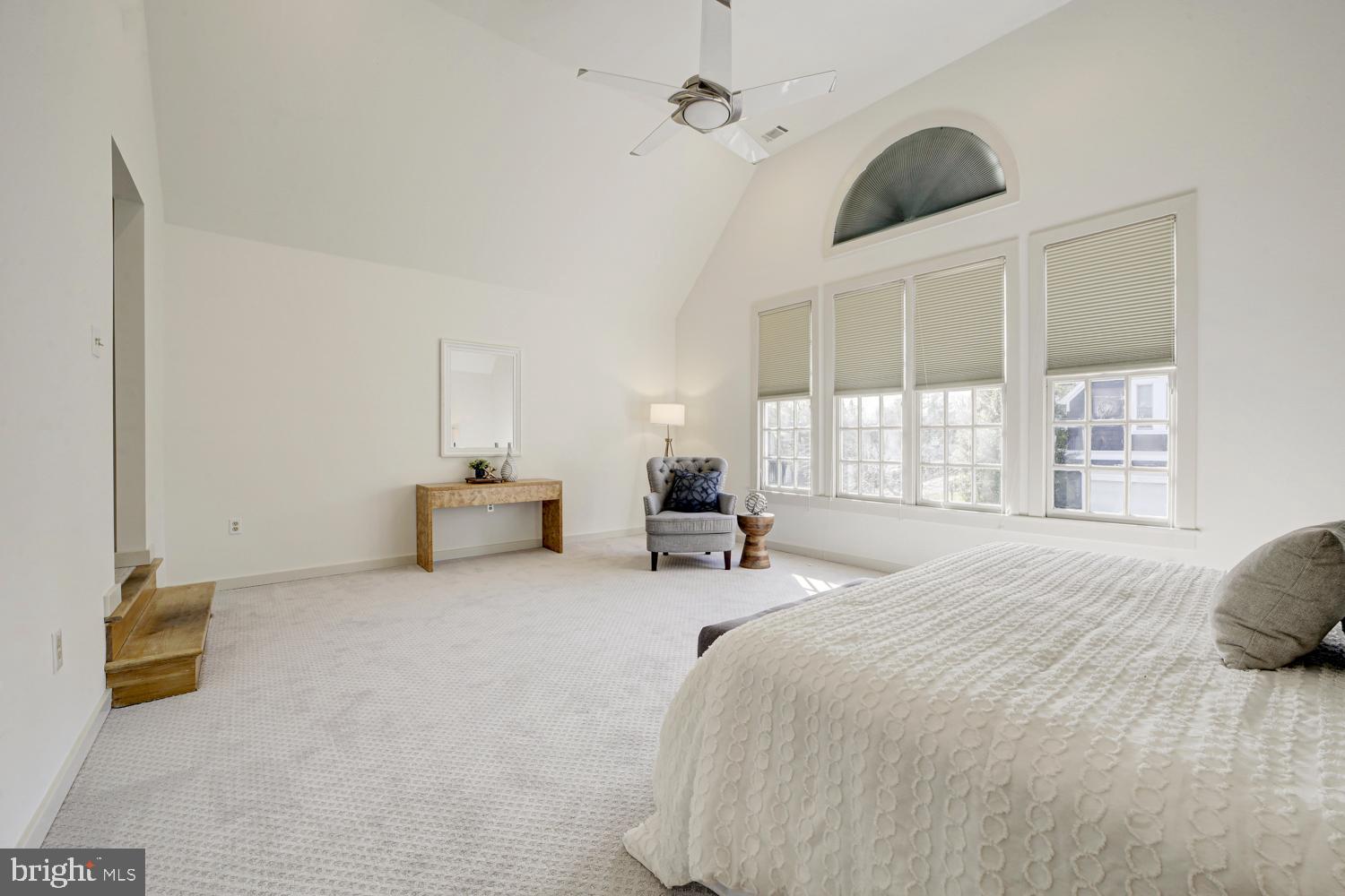 10505 Democracy Lane Potomac, MD 20854 - Photo 26 of 47 a spacious bedroom with a bed and a large window
