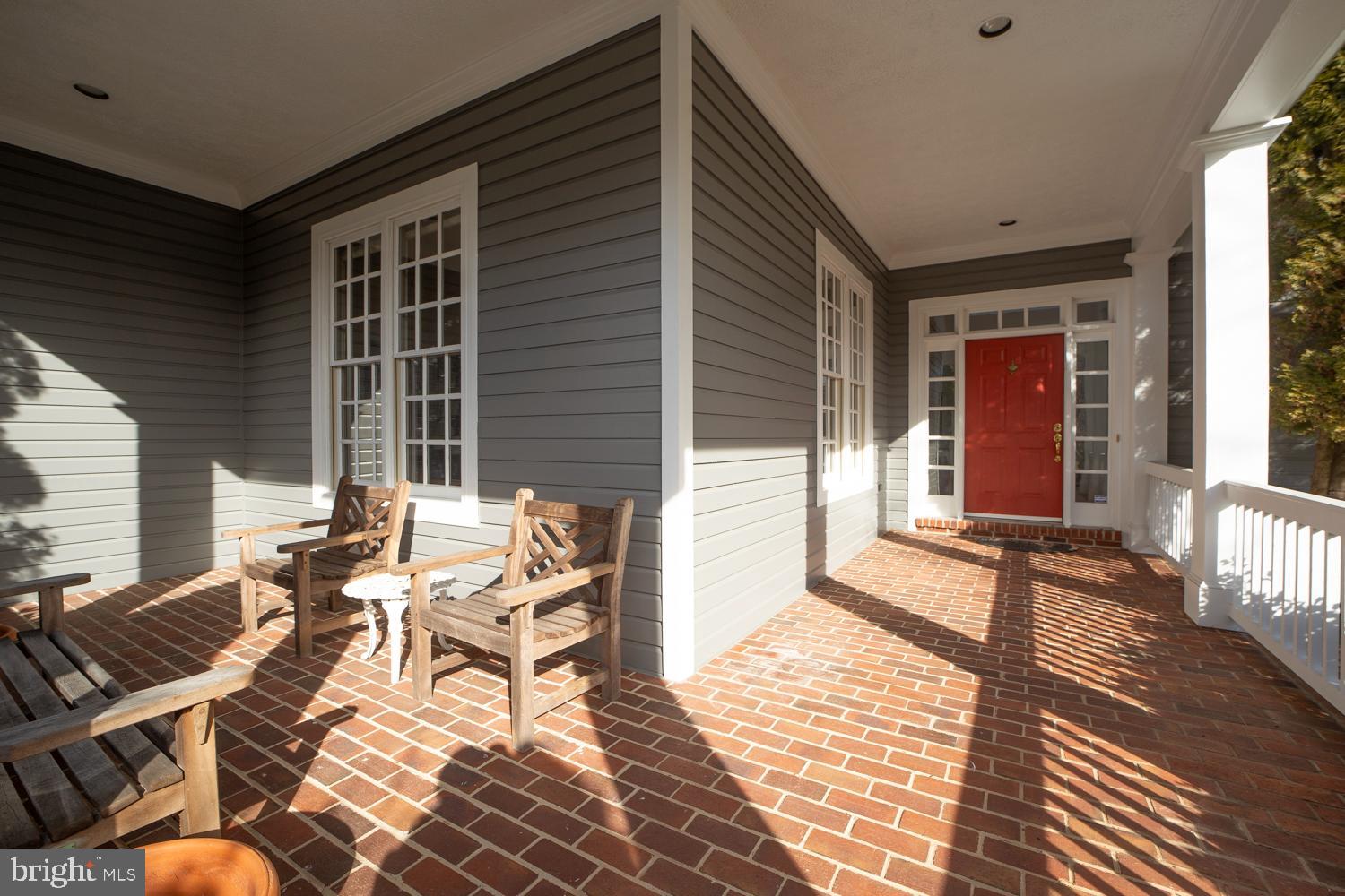 10505 Democracy Lane Potomac, MD 20854 - Photo 3 of 47 a view of a patio with table and chairs and wooden floor