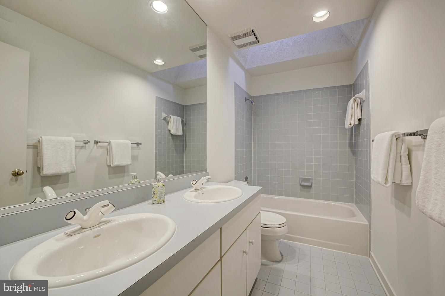 10505 Democracy Lane Potomac, MD 20854 - Photo 36 of 47 a bathroom with a sink a toilet and shower