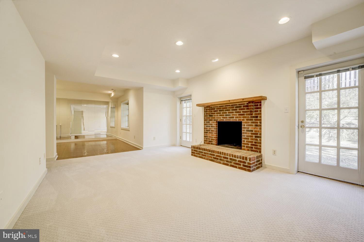 10505 Democracy Lane Potomac, MD 20854 - Photo 37 of 47 a view of an empty room with a fireplace and a window