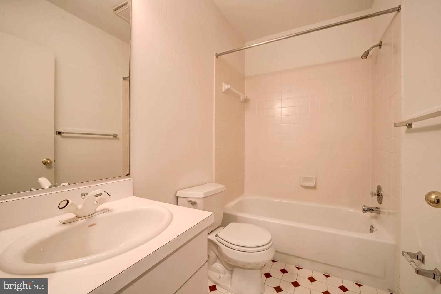 10505 Democracy Lane Potomac, MD 20854 - Photo 40 of 47 a bathroom with a sink a toilet and shower