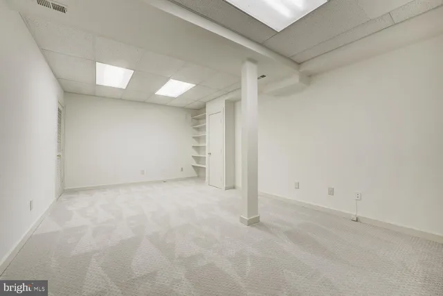 a utility room with cabinets washer and dryer