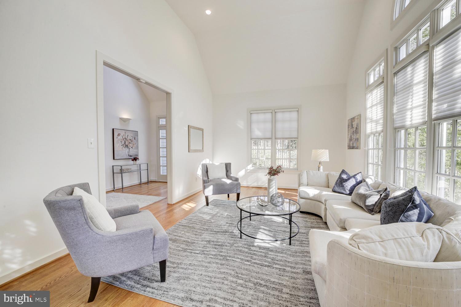 10505 Democracy Lane Potomac, MD 20854 - Photo 6 of 47 a living room with furniture and a large window